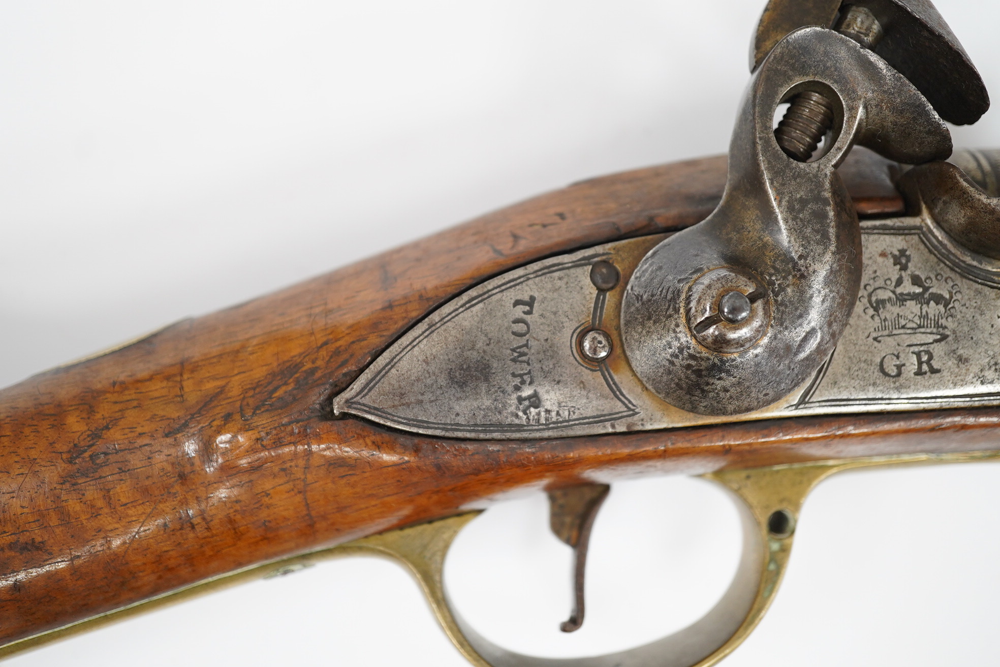 A ten bore flintlock musket of Brown Bess type, barrel 88cm, lock struck with crowned GR and Tower, regulation brass mounts. Condition - fair